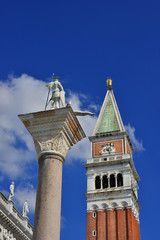 Fototapeta na wymiar Saint Theodore Column and Saint Mark Campanile in Venice