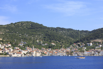 Naklejka na ściany i meble Small town with stone houses by the sea, Photo of town by the sea in summer