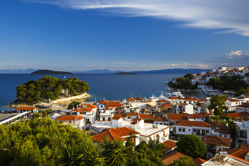 View of the old harbour on Skiathos island and Euboea in the distance, Greece.
