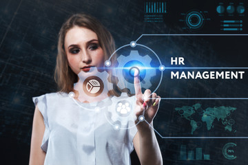 The concept of business, technology, the Internet and the network. A young entrepreneur working on a virtual screen of the future and sees the inscription: HR management