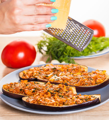 Chef is rubbing cheese