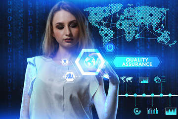 The concept of business, technology, the Internet and the network. A young entrepreneur working on a virtual screen of the future and sees the inscription: Quality assurance