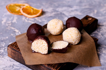 Homemade healthy vegan chocolate candys with honey and coconut flakes