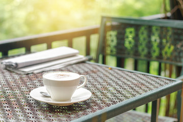 Stock photo :.Cappuccino coffee on old iron table and vintage background