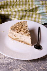 Slice of Plain New York Cheesecake on white plate