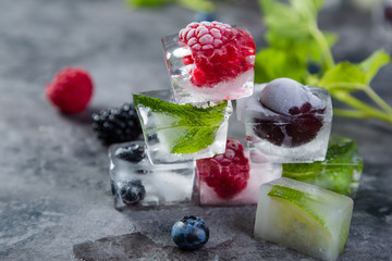 Frozen berries in ice cubes