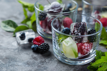 Frozen berries in ice cubes