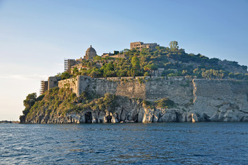 Fototapeta na wymiar The Aragonese castle in the setting sun