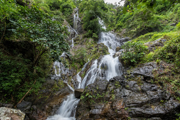 Fototapeta na wymiar Krok-E-Dok waterfall and rain forest on mountain in Khao Yai National park, Thailand.
