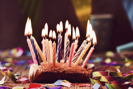 Birthday Cake With Many Lit Candles