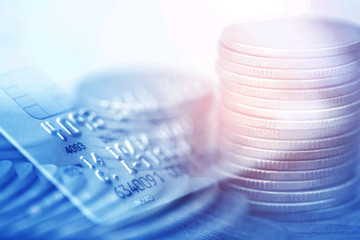 Double exposure Rows of coins of Credit cards on the table,finance and business concept,Money,soft focus and blurred style,dark tone.