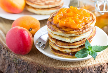 Delicious pancakes with apricots and honey.
