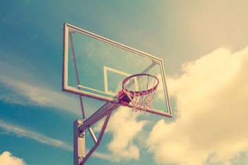 Basketball hoop against sky background © graja