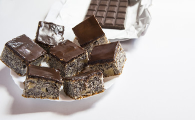 Chocolate poppy seed cake on table