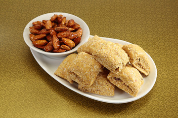 Group of Gajak or Sesame Seed Jaggery with honny coated Almond