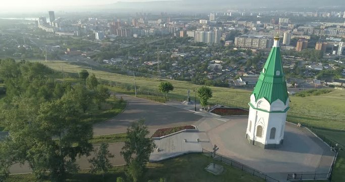 Church of Paraskeva Pyatnitsa is symbol of Krasnoyarsk. City in Siberia, Russia. Russian old architecture. Aerial drone flight around. 4K format