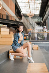 lifestyle fashion portrait of Asia woman in blue jeans