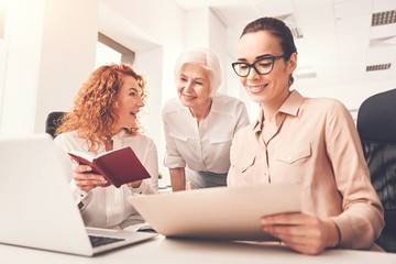 Professional ambitious ladies working in team