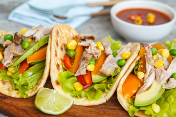 Fajitas with chicken, vegetables and spicy sauce salsa.