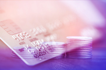 Double exposure Rows of coins of Credit cards on the table,finance and business concept,Money,soft focus and blurred style,dark tone.