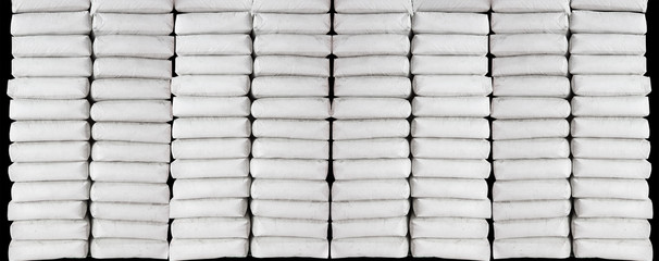 Pile of white plastic sacks in warehouse