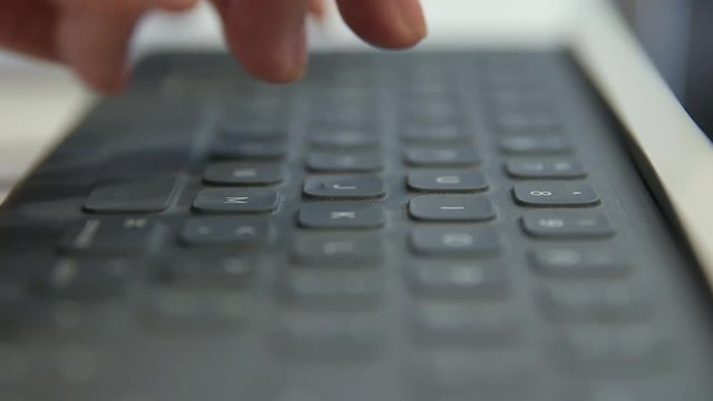 Fingers hitting keyboard