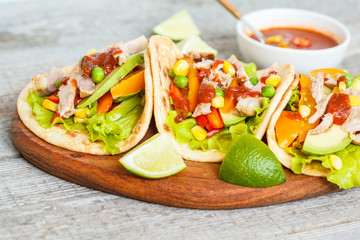 Fajitas with chicken, vegetables and spicy sauce salsa.
