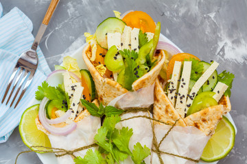 Vegan wrap or fajitas with tofu and fresh vegetables. Love for a healthy vegan food concept.