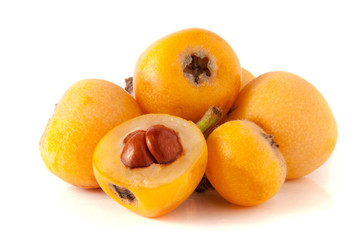 Ripe loquat or Eriobotrya japonica with leaf isolated on white background