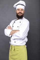Portrait of a bearded chef with arms folded