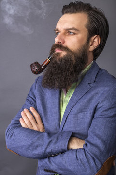 Studio shot of a handsome young man with retro look, arms holded