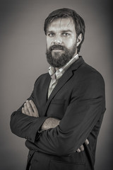 Confident business man with arms folded o