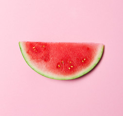 Beautiful appetizing fashion flat lay fresh watermelon on pink background. Top View. Summer Concept.