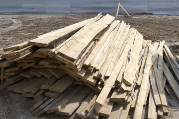 The mountain of planks on the construction site