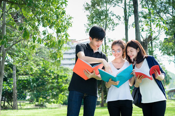 Young Students Group Looking School Folders in Education Campus University Outdoor