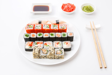 Set of sushi and rolls on white background, top view