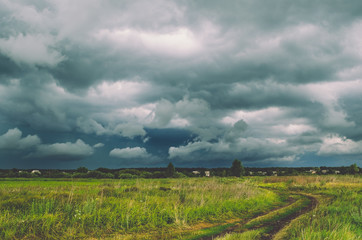 Fototapeta na wymiar Storm clouds over the field