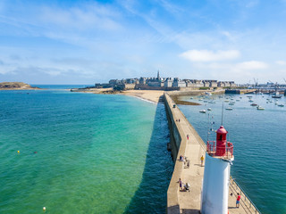 Aerial postcard of Saint Malo in Brittany France with a Lighthouse in the foreground - obrazy, fototapety, plakaty