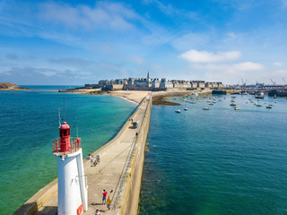 Aerial view of Saint Malo in Brittany France with a Lighthouse in the foreground - obrazy, fototapety, plakaty
