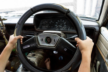 Fototapeta na wymiar Old driving a car.