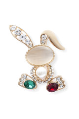 Golden brooch bunny with diamonds and moonstone isolated on white