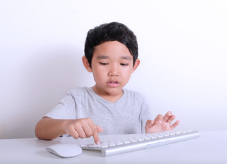 Little boy working on computer