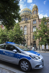 german police car in front of the old berlin synagogue germany