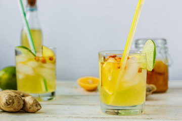 Fresh Ginger lemonade over white wooden background