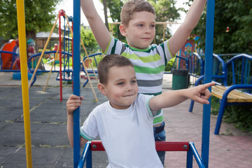Fototapeta na wymiar Brothers in the playground