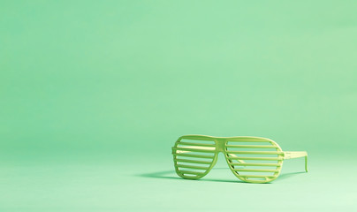 Shutter shades party glassess on a bright background