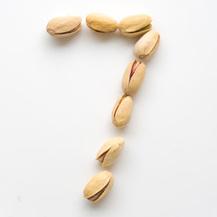 Numeral pistachios white background