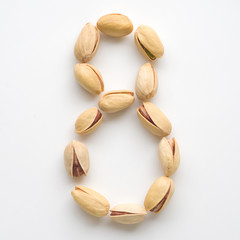 Numeral pistachios white background