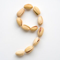 Numeral pistachios white background