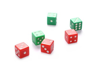 Red and green gambling dice isolated on white background